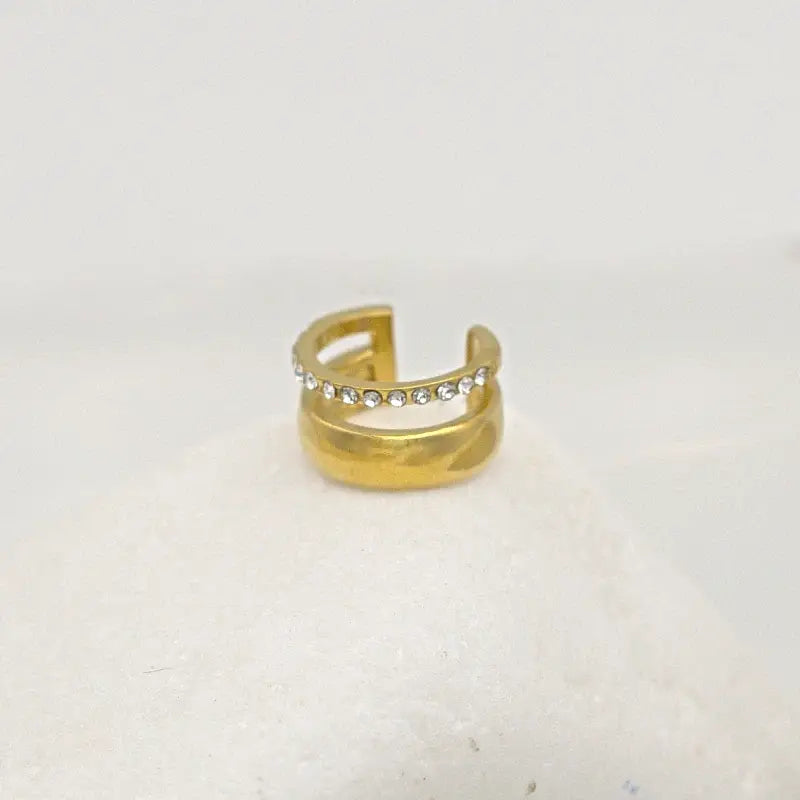 Bague d'oreilles dorée avec 2 rangées dont l'une sertie de Zircons