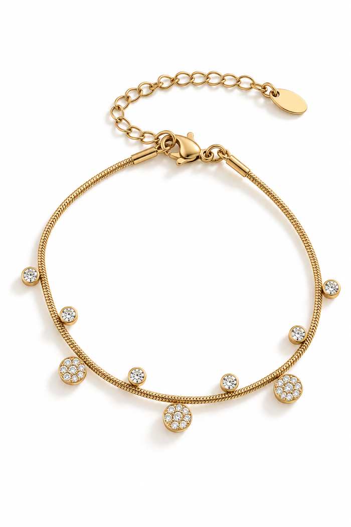 Bracelet en acier inoxydable fin, dorés avec de petits pendentifs en zircons et forme de fleur