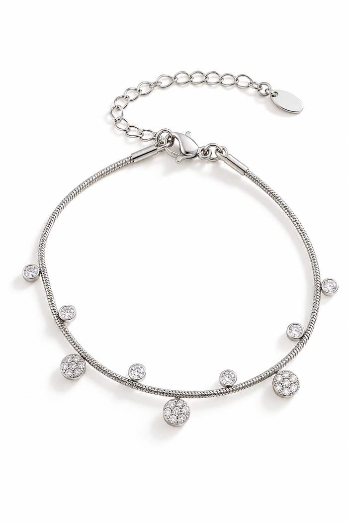 Bracelet en acier inoxydable fin, argentéavec de petits pendentifs en zircons et forme de fleur