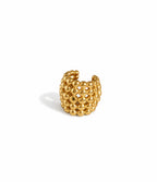 Manchette d’oreille en acier inoxydable sans piercing, formée de petites boules assemblées en une manchette haute.